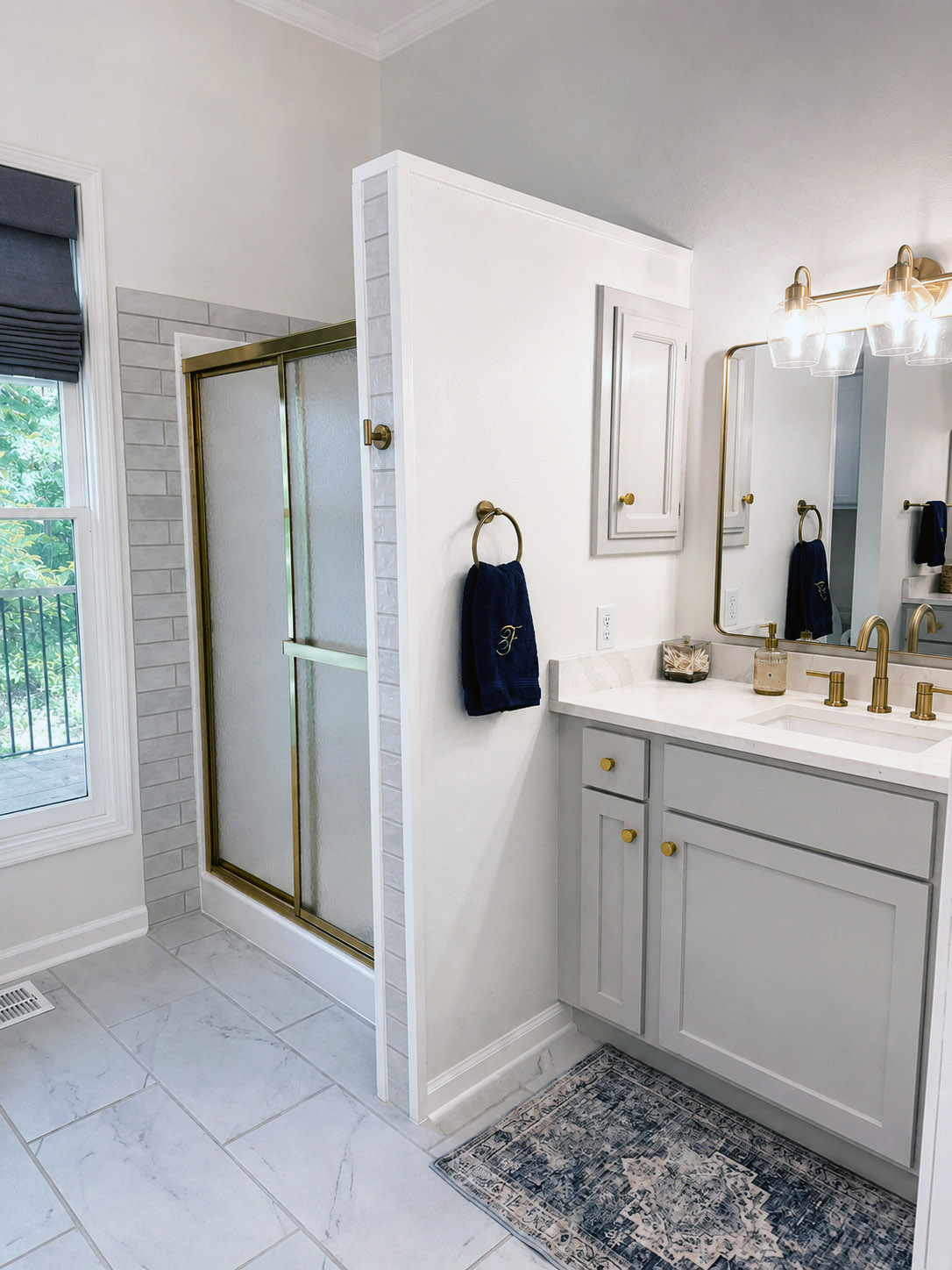 Renovated bathroom with tile shower and matte black fixtures